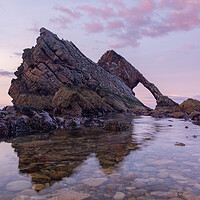 Buy canvas prints of Sunset over Bow fiddle rock by Kevin Winter
