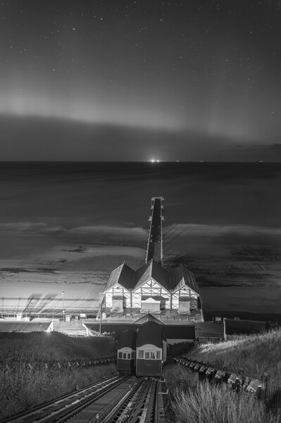 Aurora Borealis over Saltburn pier in Black and white Picture Board by Kevin Winter