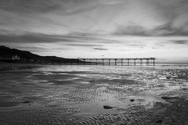 Sunset over Saltburn beach in Black and white Picture Board by Kevin Winter
