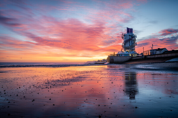 A glorious sunrise over redcar beacon Picture Board by Kevin Winter