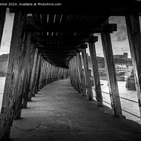 Buy canvas prints of Under the East pier by Kevin Winter