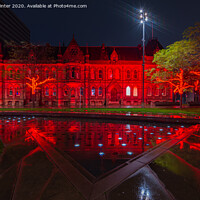 Buy canvas prints of Remembrance Red at the town hall by Kevin Winter