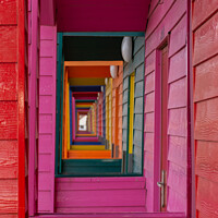 Buy canvas prints of Through the beach huts by Kevin Winter