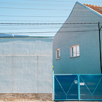Buy canvas prints of Blue house exterior by Sanga Park