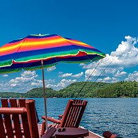 Buy canvas prints of Rainbow Umbrella Lakeside by Blok Photo 