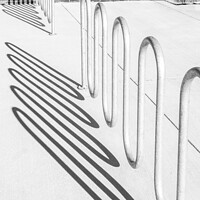 Buy canvas prints of Bike rack shadows cast form abstract shapes on concrete by Blok Photo 