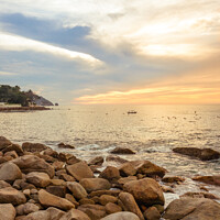Buy canvas prints of Dramatic Setting Sun and Rocky Shore  by Blok Photo 