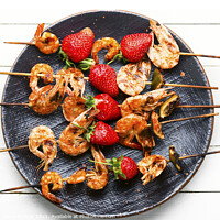 Buy canvas prints of Grilled tiger shrimps skewers with strawberries by Mykola Lunov Mykola