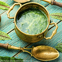 Buy canvas prints of Green sorrel soup,wooden table by Mykola Lunov Mykola