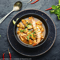 Buy canvas prints of Tom yum soup with seafood and coconut milk,top vie by Mykola Lunov Mykola