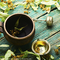 Buy canvas prints of Healing tea from linden,cup of linden tea by Mykola Lunov Mykola
