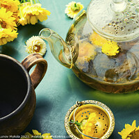 Buy canvas prints of Glass teapot with flower tea,herbalism by Mykola Lunov Mykola