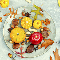 Buy canvas prints of Autumn food, pumpkins and nuts. by Mykola Lunov Mykola