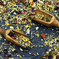 Buy canvas prints of Flowers tea mix in a wooden scoops by Mykola Lunov Mykola