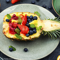 Buy canvas prints of Fruit salad in half a pineapple, vegan concept. by Mykola Lunov Mykola