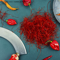 Buy canvas prints of Cutting red chilly peppers. by Mykola Lunov Mykola