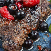 Buy canvas prints of Beef steak in berry sauce. by Mykola Lunov Mykola