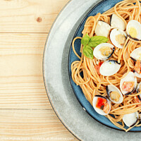 Buy canvas prints of Dish of spaghetti with clams, space for text. by Mykola Lunov Mykola