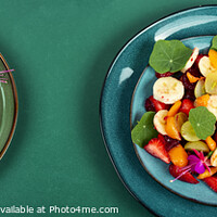 Buy canvas prints of Fruit salad with nasturtium, flat lay. by Mykola Lunov Mykola