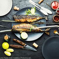 Buy canvas prints of Whole grilled mackerel,skewered by Mykola Lunov Mykola