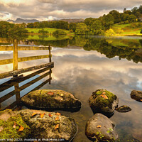 Buy canvas prints of Loughrigg Tarn mottled light by Northern Wild