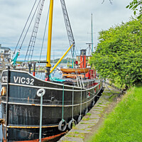Buy canvas prints of VIC32 Clyde Puffer in Crinan Canal by chris hyde