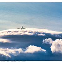 Buy canvas prints of aircraft in the distance under storm clouds by chris hyde