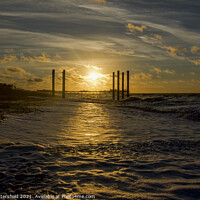 Buy canvas prints of Brighton pier glowing in the sunrise by Julie Tattersfield