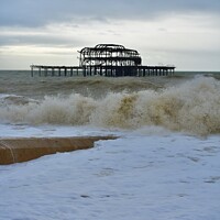 Buy canvas prints of Brighton west pier stormy waves by Julie Tattersfield
