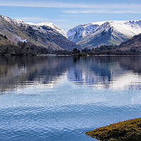 Buy canvas prints of View across Ullswater to the snow capped Rake Crag by Malcolm Lander