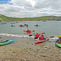Buy canvas prints of Canoes at Lulworth Cove, Dorset by Laurence Tobin