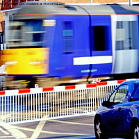 Buy canvas prints of Fast Train on Level Crossing by Laurence Tobin