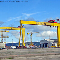 Buy canvas prints of Shipyard Gantry Cranes, Belfast by Laurence Tobin