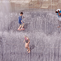 Buy canvas prints of Children Having Fun in Fountains by Laurence Tobin