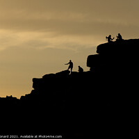 Buy canvas prints of Sunset tourism at stanage edge, a couple take a selfie, climbers too by Rhys Leonard