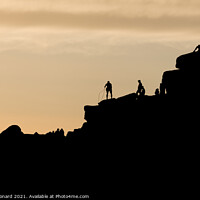 Buy canvas prints of Striking sunset scene of stanage edge rock formations. People on top by Rhys Leonard