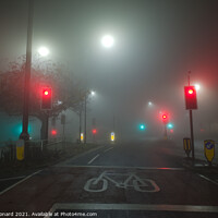 Buy canvas prints of Colored traffic lights and white street lamps shin by Rhys Leonard