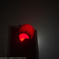 Buy canvas prints of A british traffic light shines red, indicating sto by Rhys Leonard