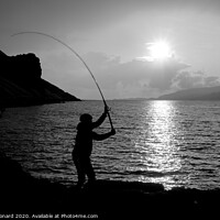 Buy canvas prints of Young man fishing with feathers for mackerel B+W by Rhys Leonard