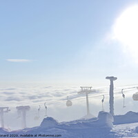 Buy canvas prints of T-bar and gondola lifts emerge through the clouds into the sun by Rhys Leonard