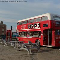Buy canvas prints of Street food diner bus at the royal albert dock, Liverpool, in sunlight. by Rhys Leonard