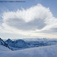 Buy canvas prints of Blue alps landscape, from the top of a ski run. by Rhys Leonard