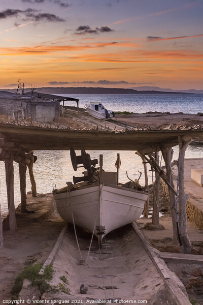Fishing boat on its jetty at sunset Picture Board by Vicente Sargues
