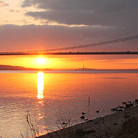 Buy canvas prints of The Sun setting under the Humber Bridge by Judith Oatley