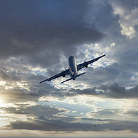 Buy canvas prints of Passenger airplane on a cloudy sky by Arpad Radoczy