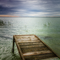 Buy canvas prints of Wooden pier in lake Balaton of Hungary in a cloudy by Arpad Radoczy
