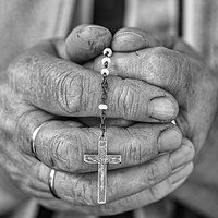 Buy canvas prints of Elderly lady s hands holding a rosary, black and w by Arpad Radoczy