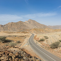 Buy canvas prints of A road going thru the deserted mountains of Oman by David GABIS