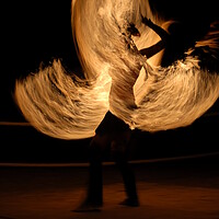 Buy canvas prints of Fire dancer making night show with flames rotaint torch by Alessandro Della Torre