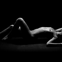 Buy canvas prints of Nude woman fine art naked lying sleeping on black by Alessandro Della Torre